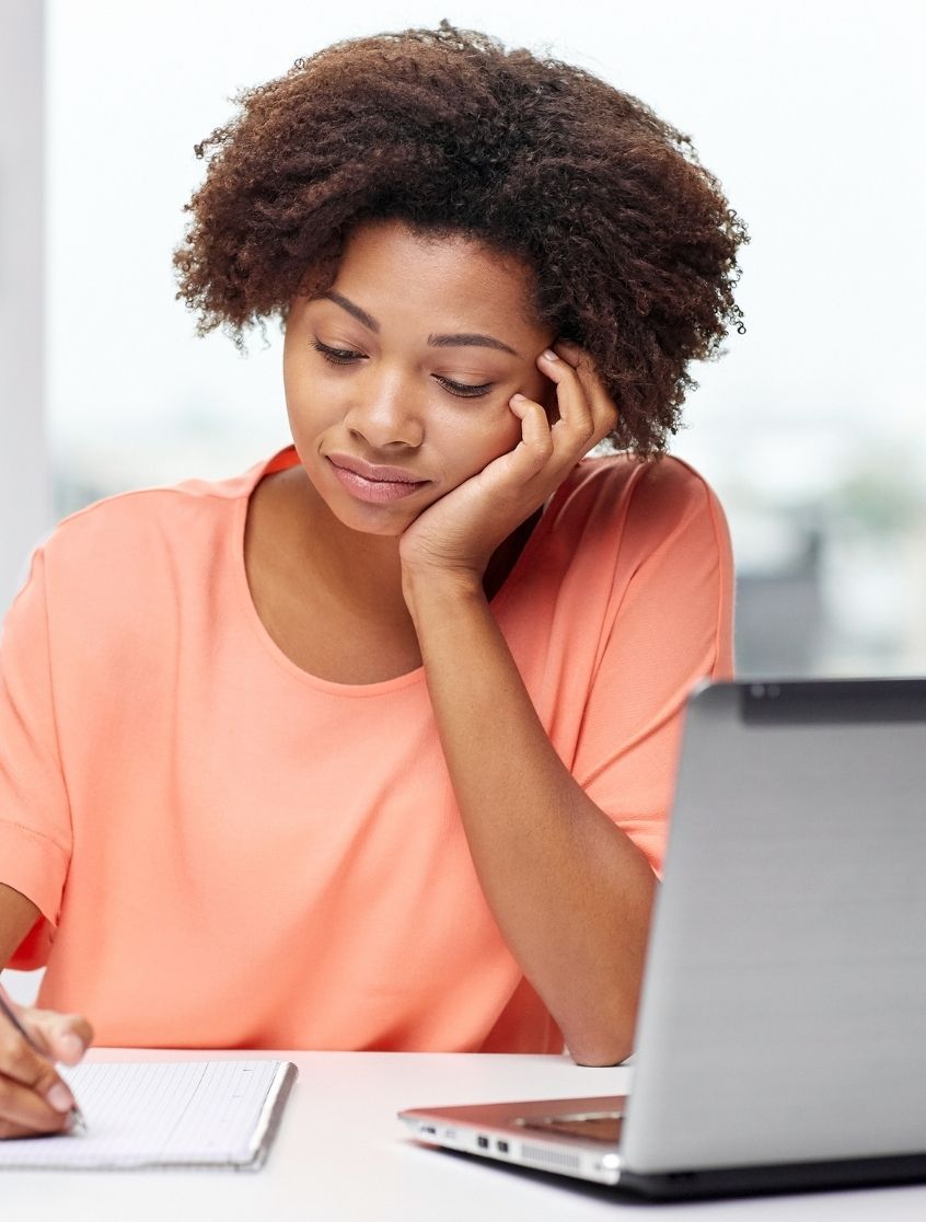 Woman Writing with laptop